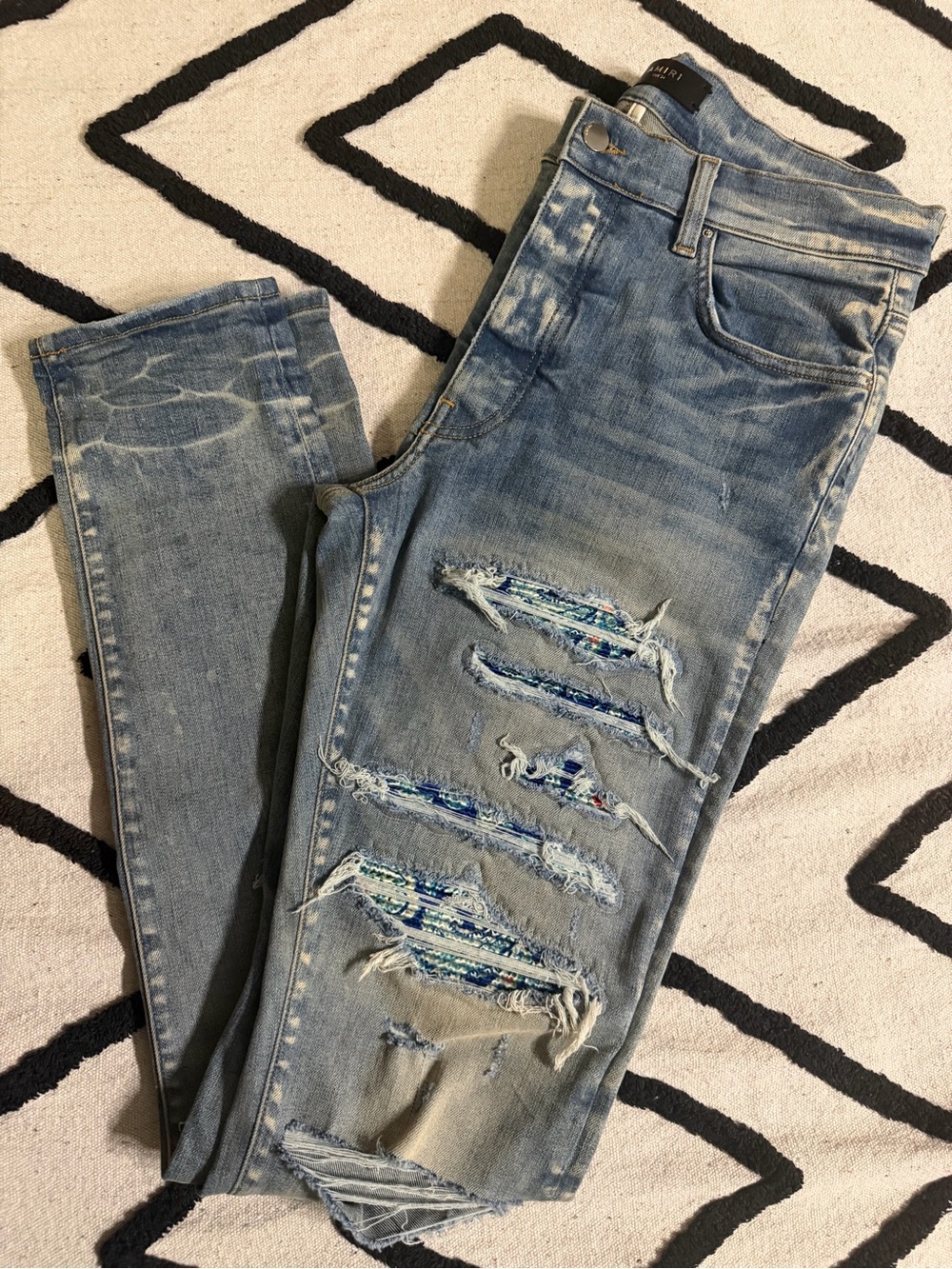 AMIRI Light Blue Distressed Skinny Jeans with Embroidered Patch Insets